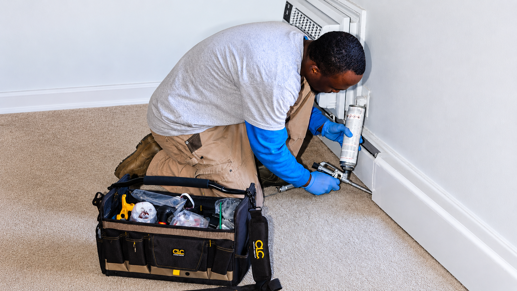 Professional pest control technician preparing treatment